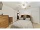 Bedroom with a double bed, ceiling fan, dresser, and access to another room at 4305 E Earll Dr, Phoenix, AZ 85018