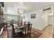 Bright dining room featuring a wood table and chairs, piano, and chandelier at 4305 E Earll Dr, Phoenix, AZ 85018