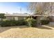 Charming ranch-style home with a spacious front yard and mature shrubs at 4305 E Earll Dr, Phoenix, AZ 85018