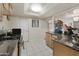 L shaped kitchen with granite counters and stainless steel appliances at 4305 E Earll Dr, Phoenix, AZ 85018