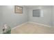 Small spare room with tiled floor and wall-mounted shelving at 4305 E Earll Dr, Phoenix, AZ 85018