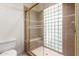 Bathroom with shower stall and built-in glass block window at 4532 E Sandra Ter, Phoenix, AZ 85032