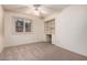 Bedroom with built-in shelves, desk, and ceiling fan at 4532 E Sandra Ter, Phoenix, AZ 85032