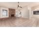 Living room with brick fireplace and tile flooring at 4532 E Sandra Ter, Phoenix, AZ 85032