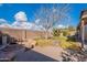 Backyard view with fire pit and large boulders at 470 E Echo Ln, Florence, AZ 85132