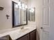 Bathroom boasts a vanity with marble countertop at 470 E Echo Ln, Florence, AZ 85132