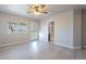 Bedroom with private bathroom access and ceiling fan at 470 E Echo Ln, Florence, AZ 85132