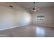 Simple bedroom with wood-look floors and large wall space at 470 E Echo Ln, Florence, AZ 85132