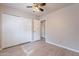 Bedroom with double door closet and wood-look flooring at 470 E Echo Ln, Florence, AZ 85132