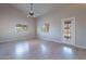 Bright bedroom with wood-look floors and ceiling fan at 470 E Echo Ln, Florence, AZ 85132