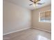 Spacious bedroom featuring a window with blinds and ceiling fan at 470 E Echo Ln, Florence, AZ 85132