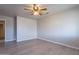 Simple bedroom with ceiling fan and laminate floors at 470 E Echo Ln, Florence, AZ 85132