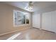 Bedroom with bay window, wood-look floors and double closets at 470 E Echo Ln, Florence, AZ 85132