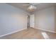 Bright bedroom with ceiling fan and laminate flooring at 470 E Echo Ln, Florence, AZ 85132