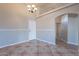 Bright dining room with tile floors and built-in shelving at 470 E Echo Ln, Florence, AZ 85132