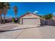 Tan house with attached garage, driveway, and desert landscaping at 470 E Echo Ln, Florence, AZ 85132