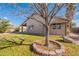 House exterior with tree and landscaping at 470 E Echo Ln, Florence, AZ 85132