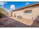 House exterior with AC unit and yard view at 470 E Echo Ln, Florence, AZ 85132