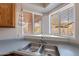 Kitchen sink with a corner window and a three-tiered basket at 470 E Echo Ln, Florence, AZ 85132