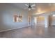 Open living room featuring wood-look floors and access to other rooms at 470 E Echo Ln, Florence, AZ 85132