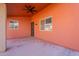 Covered patio with ceiling fan and access door at 470 E Echo Ln, Florence, AZ 85132