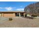 Charming single-story home featuring a well-manicured desert landscape and an inviting covered porch area at 4762 E Pawnee Cir, Phoenix, AZ 85044