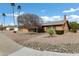 Quaint single-story home with mature landscaping, a desert rock yard, and a cozy covered entrance at 4762 E Pawnee Cir, Phoenix, AZ 85044