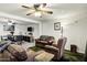 Living room with comfortable seating area, ceiling fan, and open floor plan at 4762 E Pawnee Cir, Phoenix, AZ 85044