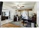 Bright home office with desk, neutral rug, and ceiling fan at 4762 E Pawnee Cir, Phoenix, AZ 85044