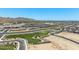 Aerial view of community with central park including playground and picnic area at 5030 W Hunter Trl, San Tan Valley, AZ 85144