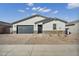 Charming single-story home featuring a gray color scheme, stone accents, and a well-maintained front yard at 5030 W Hunter Trl, San Tan Valley, AZ 85144