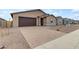 New construction home with a brick paver driveway at 5030 W Hunter Trl, San Tan Valley, AZ 85144