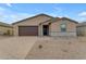 Single-story house with brown garage door and stone accents at 5030 W Hunter Trl, San Tan Valley, AZ 85144