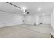 Spacious garage featuring concrete floor and extra space at 5030 W Hunter Trl, San Tan Valley, AZ 85144