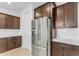 Stainless steel refrigerator in a modern kitchen at 5030 W Hunter Trl, San Tan Valley, AZ 85144