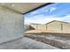 Covered patio with open view into a large dirt backyard with perimeter block wall at 5030 W Hunter Trl, San Tan Valley, AZ 85144