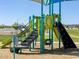 Neighborhood park playground features play set, stairs, slide, and climbing wall at 5030 W Hunter Trl, San Tan Valley, AZ 85144