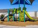 Colorful playground equipment including a slide, climbing wall, and bridge at 5030 W Hunter Trl, San Tan Valley, AZ 85144