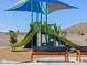 Community playground with slides and shaded area with benches at 5030 W Hunter Trl, San Tan Valley, AZ 85144