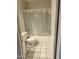 Bathroom with a shower and tub combination with a toilet and white tiled floors at 5035 N 17Th Ave # 206, Phoenix, AZ 85015