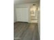 Clean bedroom with laminate flooring, closet, and en suite bathroom at 5035 N 17Th Ave # 206, Phoenix, AZ 85015