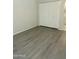 Bedroom with laminate flooring and a closet with a sliding door at 5035 N 17Th Ave # 206, Phoenix, AZ 85015