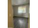 A gray bedroom with a window and laminate flooring, providing a serene living space at 5035 N 17Th Ave # 206, Phoenix, AZ 85015