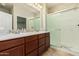 Bathroom with double sinks, shower, and tile flooring at 5219 W Buckskin Dr, Eloy, AZ 85131