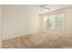 Bedroom with ceiling fan and large window at 5219 W Buckskin Dr, Eloy, AZ 85131