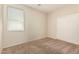 Well-lit bedroom with carpet flooring and double door closet at 5219 W Buckskin Dr, Eloy, AZ 85131