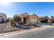 House with a two-car garage and desert landscaping at 5219 W Buckskin Dr, Eloy, AZ 85131