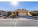 Single story home with a two-car garage and desert landscaping at 5219 W Buckskin Dr, Eloy, AZ 85131