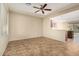 Living area with kitchen access and tile flooring at 5219 W Buckskin Dr, Eloy, AZ 85131