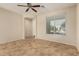 Spacious living room with tile flooring and a ceiling fan at 5219 W Buckskin Dr, Eloy, AZ 85131